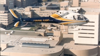 1980s photo of the first survival flight helicopter on a mission