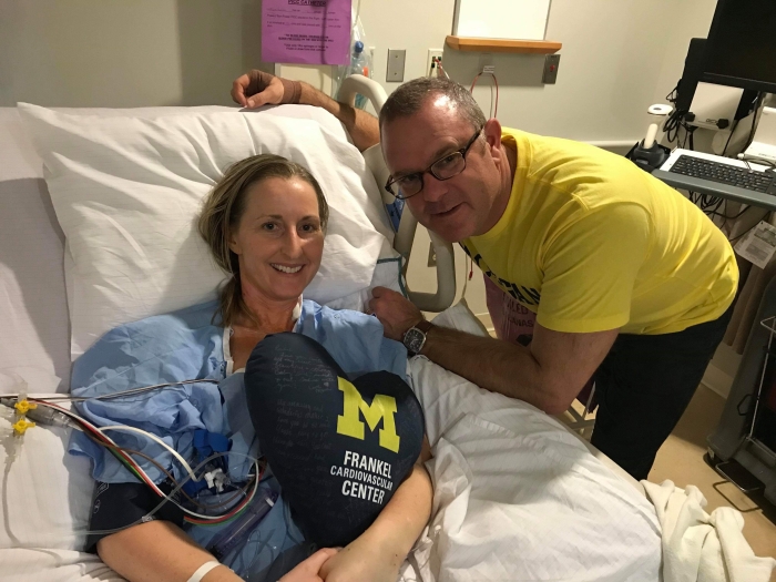 Rachel smiles for a photo from her hospital bed