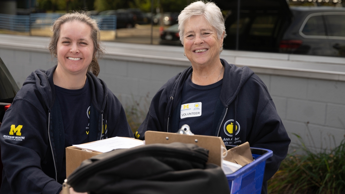 Ann Arbor Meals on Wheels volunteers loading groceries