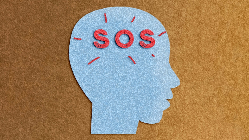 SOS in the brain red words and blue drawing of a side face and brown background