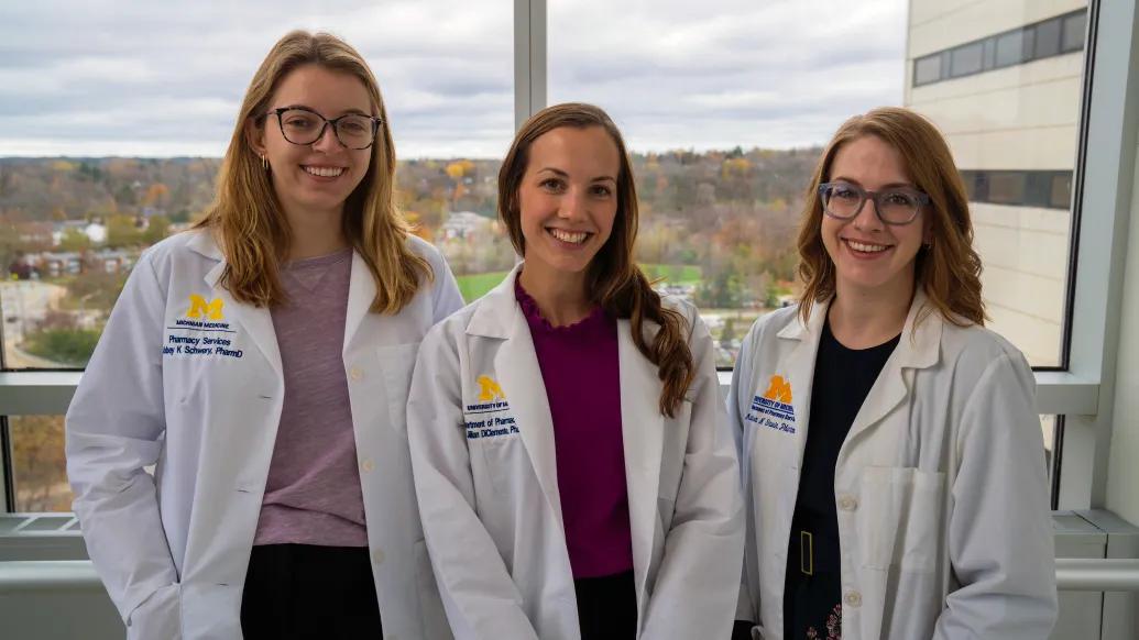 three pharmacists smiling 