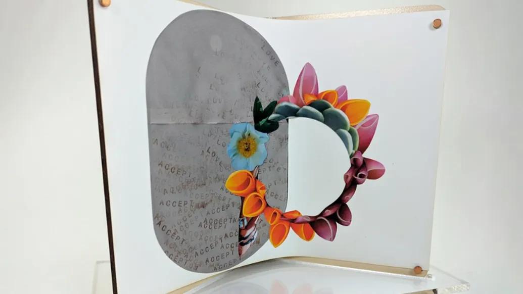 art work with flower circle green teal orange yellow pink on display 