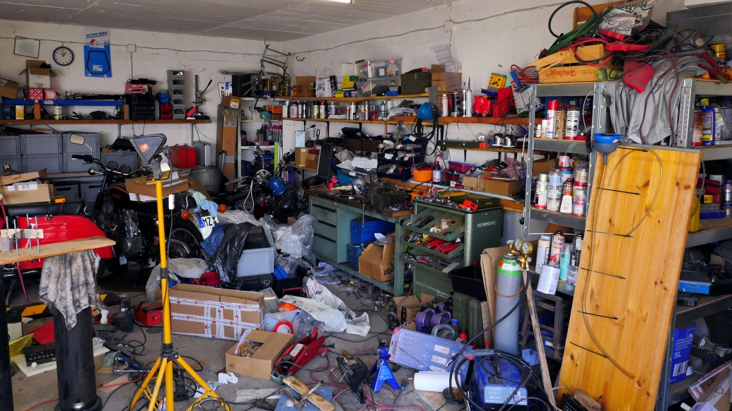 Photo of a cluttered, messy garage