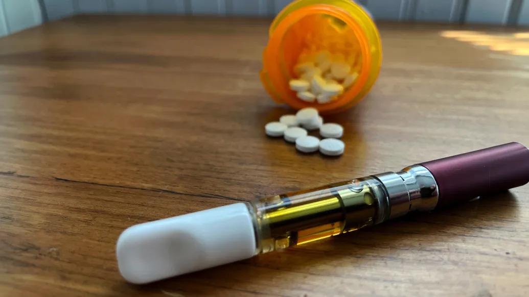 pills spilling out of bottle 