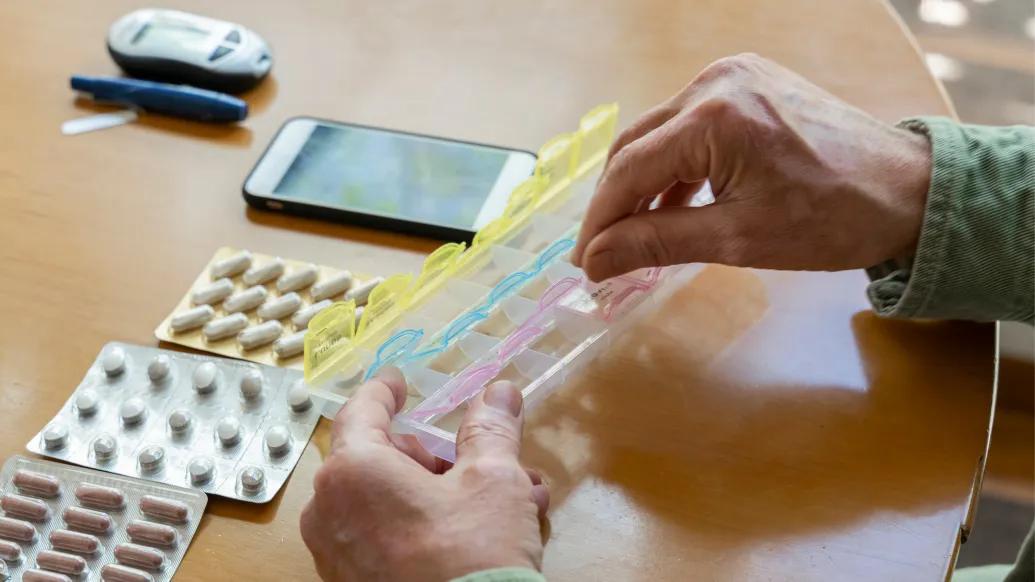 person handling medicine 