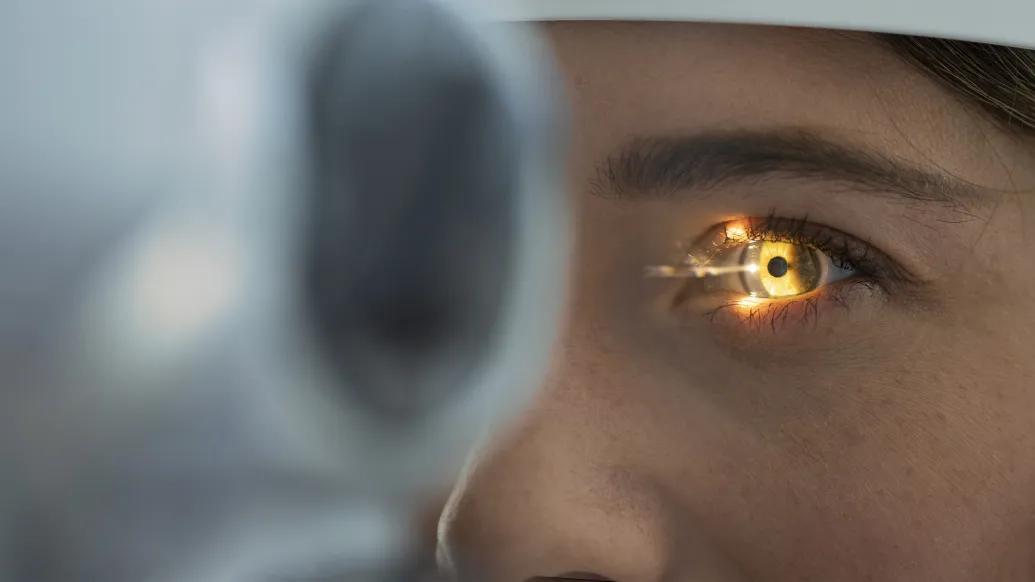 eye flashlight in exam close up of woman's eye