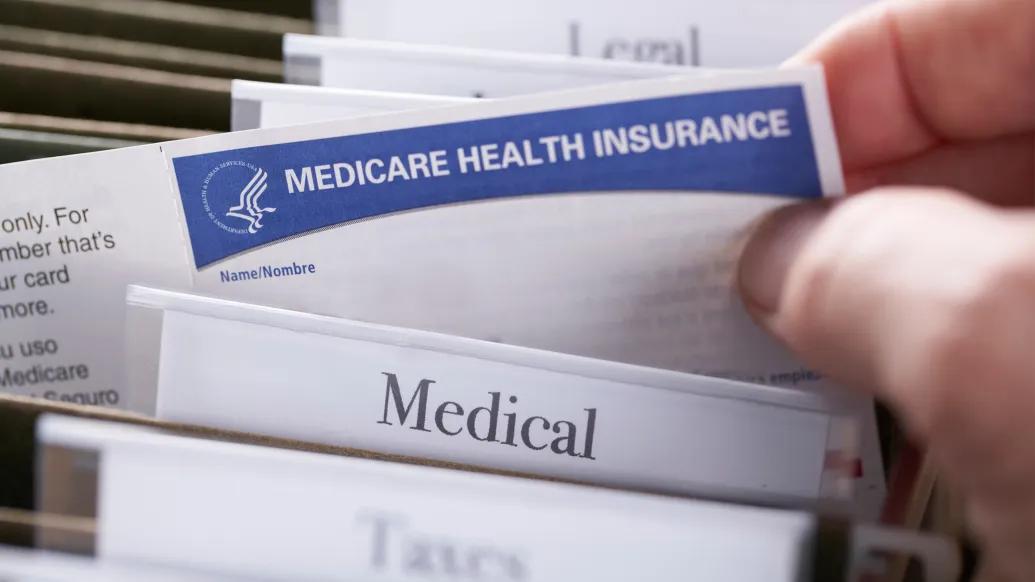 medical files medical health insurance paper someone picking it up