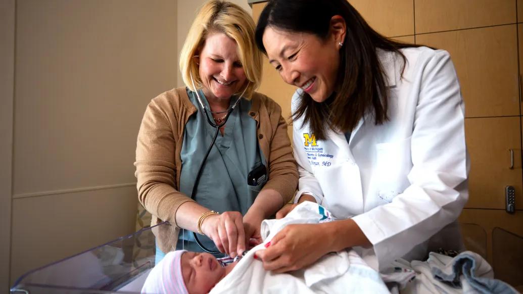 Dr. Helen Morgan and RN Mindy Magee care for a newborn at U-M Health Von Voigtlander Women's Hospital
