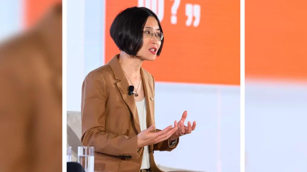 Dr. Zhen Xu pictured on stage speaking