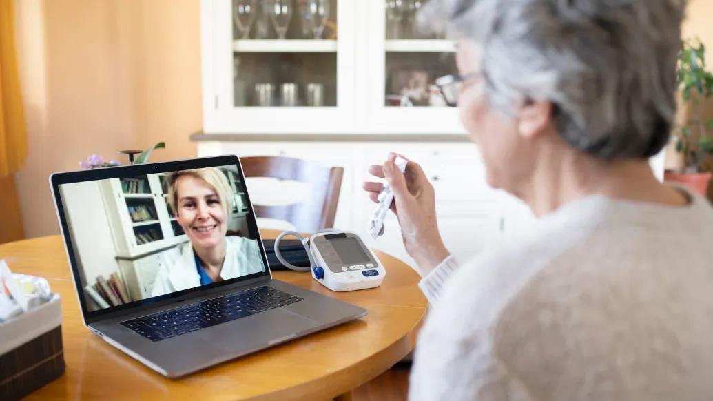 woman talking to doctor on computer