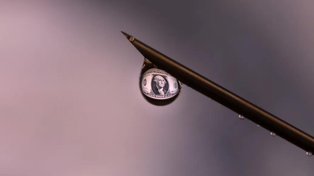 water droplet with money in it