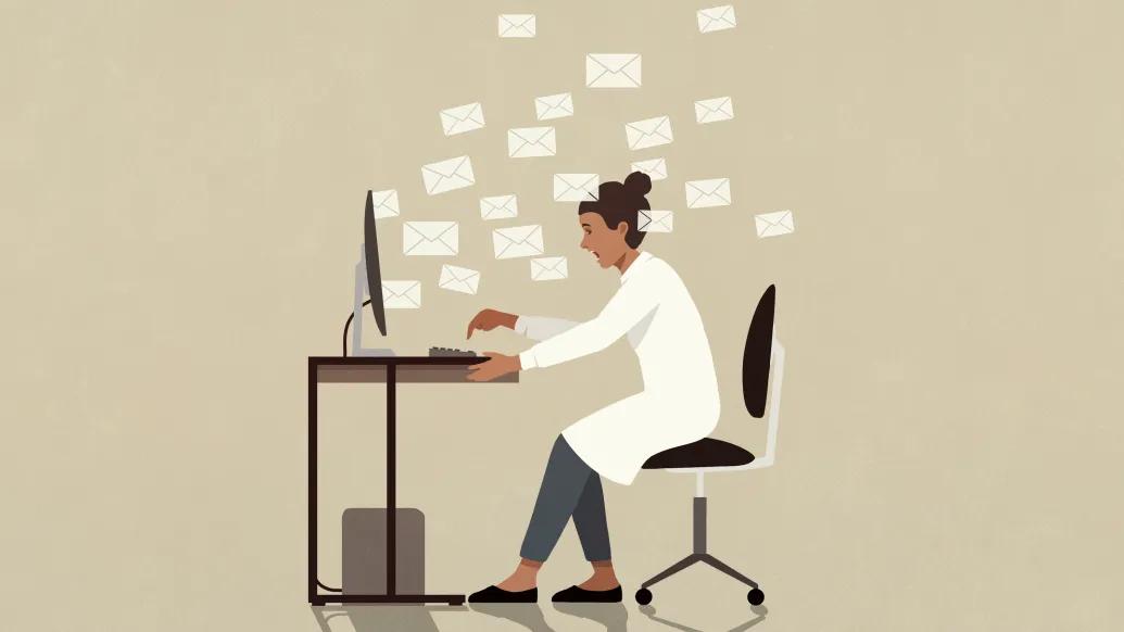 doctor at desk computer stressed and emails floating all in the air