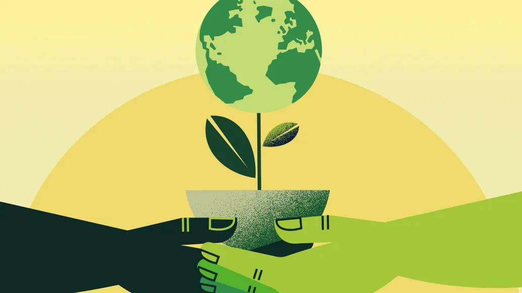 Two hands holding potted plant with earth blooming. 