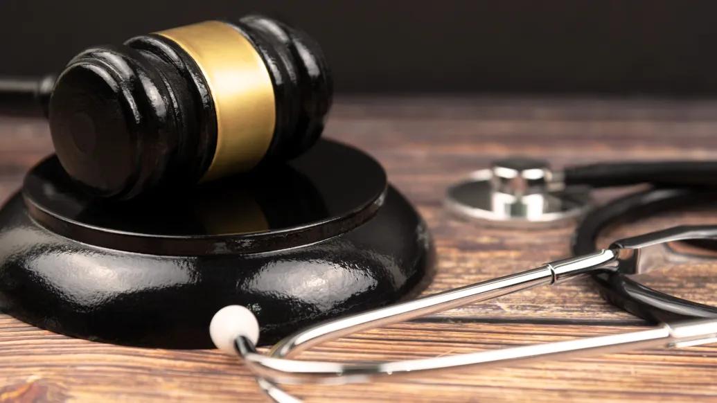 stethoscope close up black and wood table