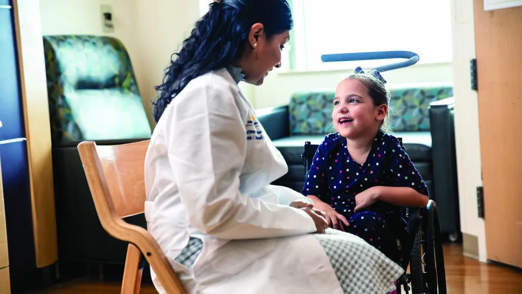 doctor sitting with patient in room