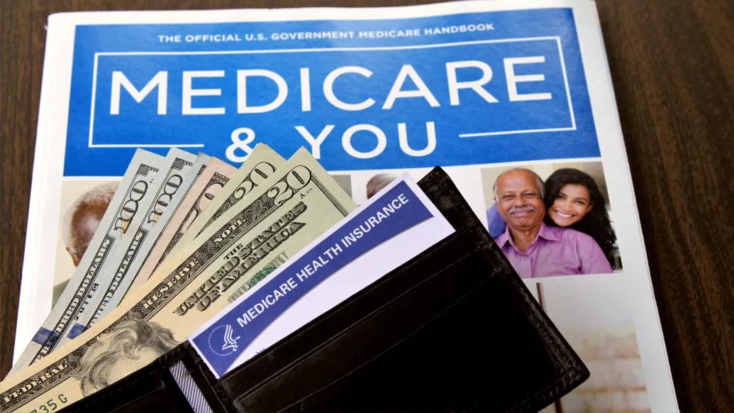 medicare & you document with wallet open with dollar bills coming out
