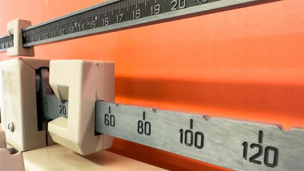 scale close up of numbers orange wall