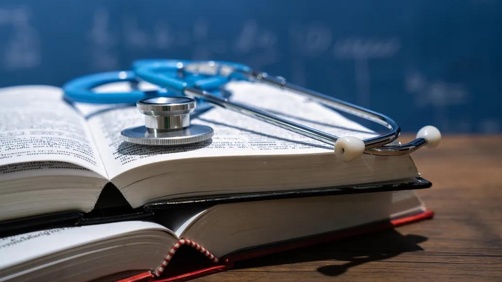 book with stethoscope on it 