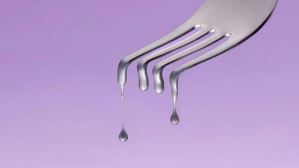 fork dripping purple background