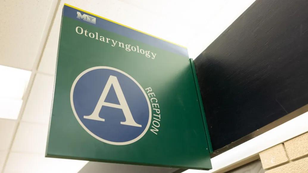 medical sign in green with A symbol on it