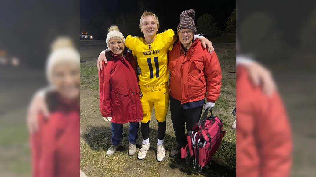 Mathie (left) and her husband (right) at their grandson's football game. Credit: Christine Mathie.
