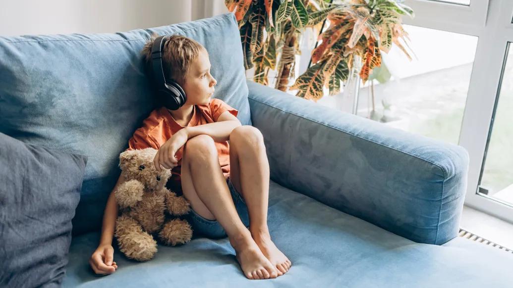boy sitting listening to headphones