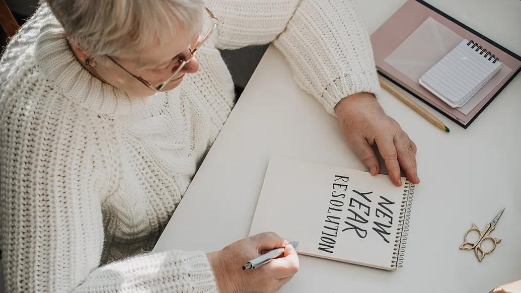 Older woman making new year's resolutions