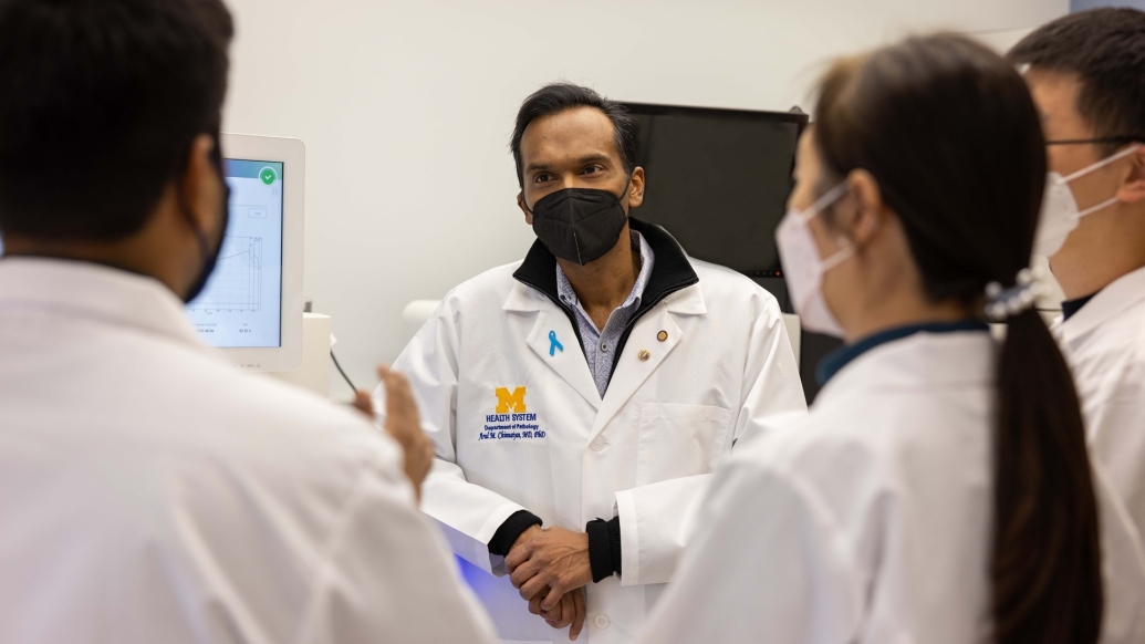 Dr. Chinnaiyan discusses with his team members on data