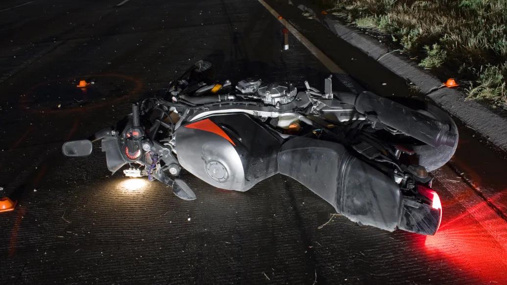 motorcycle on ground in street