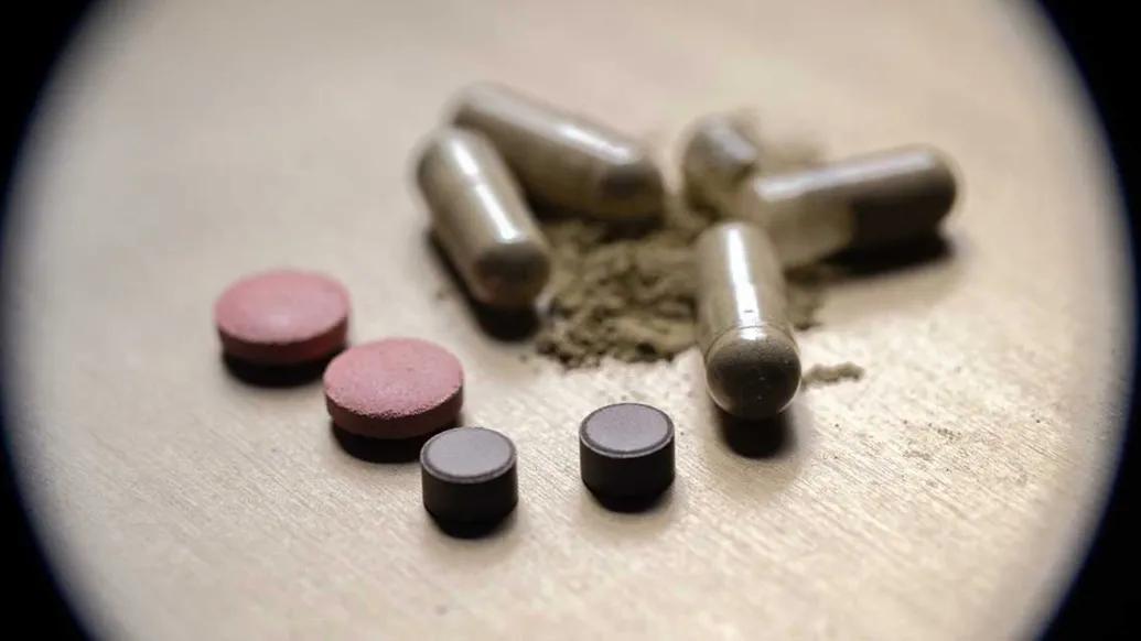 pills close up some powder some round some long