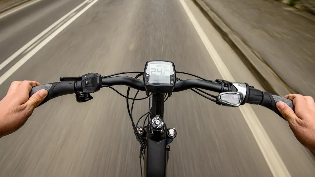e-bike handles on road close up 