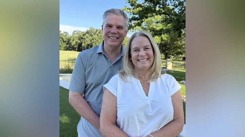 Double portrait of the Templemans smiling and standing together affectionately. 