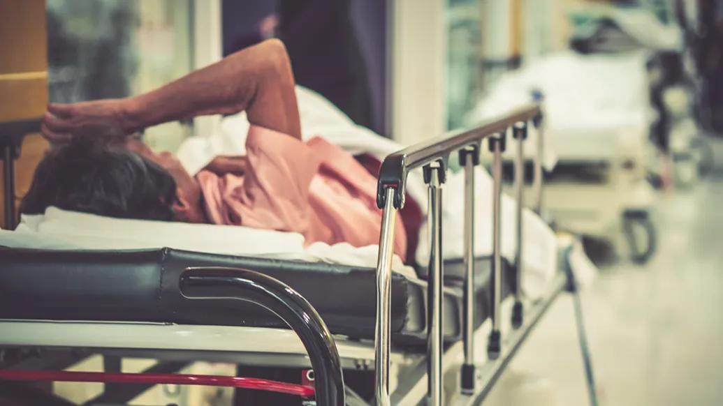 Emergency boarding patient in a hallway gurney