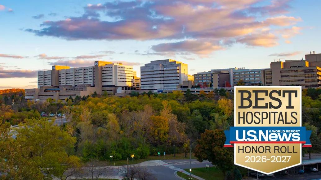 A logo of US News and World Report honor roll 2026-2027 with university of Michigan medical campus.