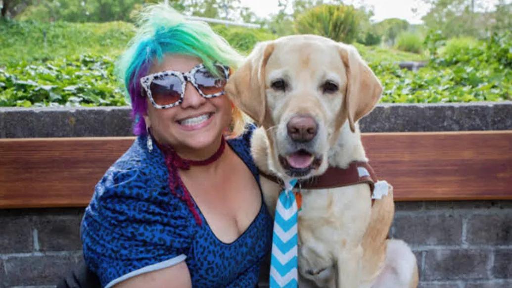 woman with dog smiling