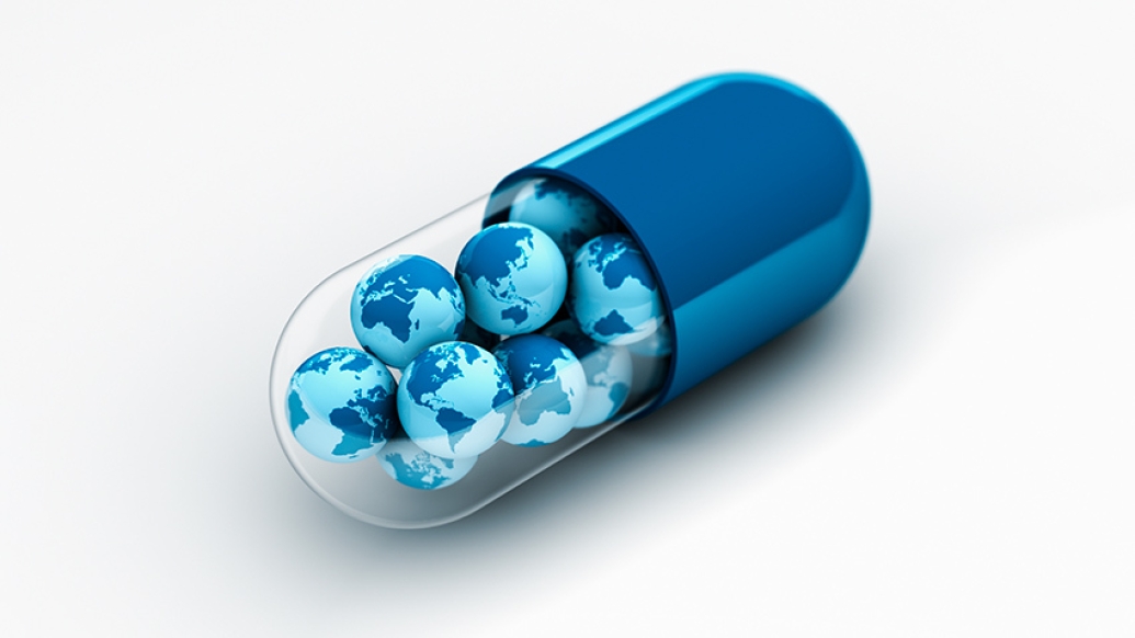 blue pill with globes inside of it piled up