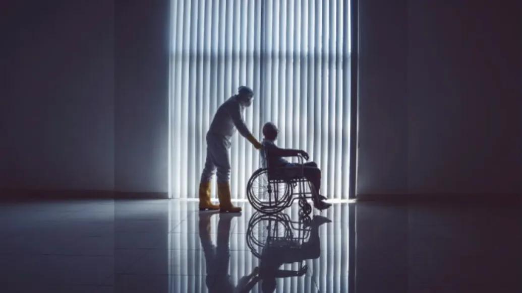 COVID_patient_being_pushed_in_wheelchair