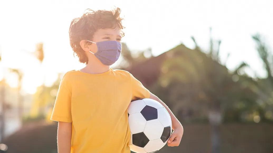 child soccer ball yellow shirt with mask