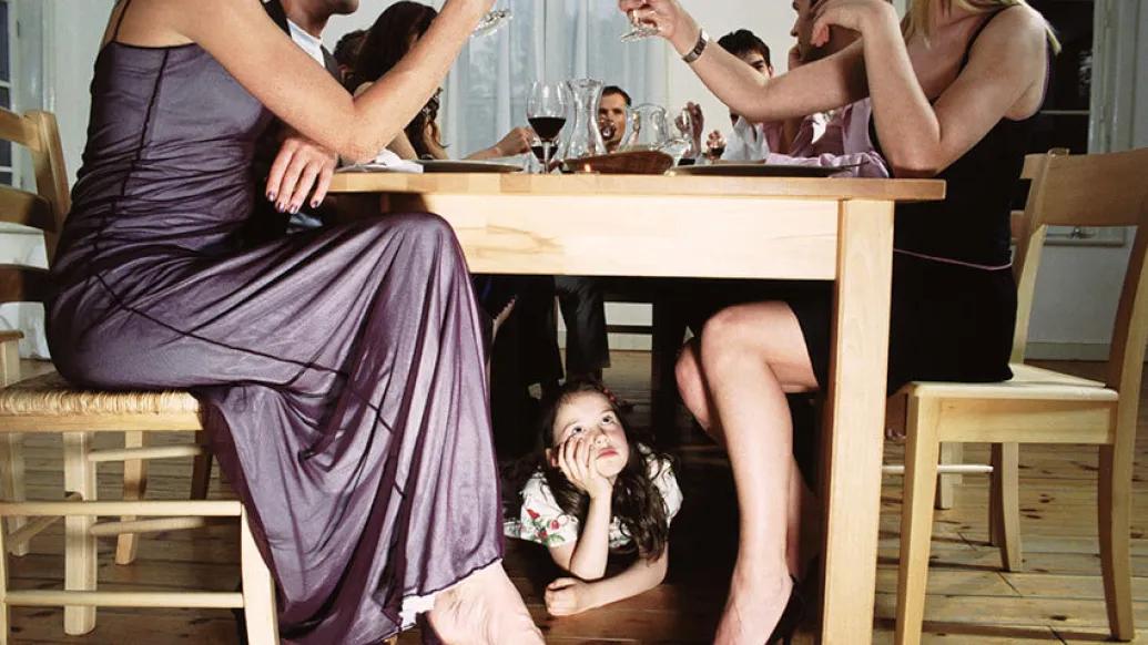 Child under table adult alcohol