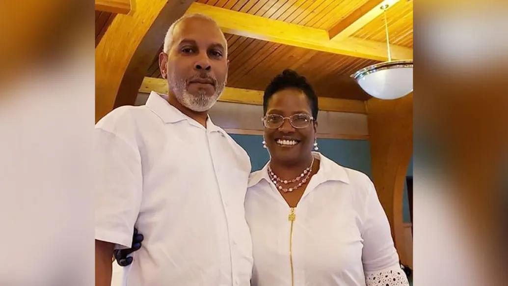 husband and wife smiling wearing white shirts