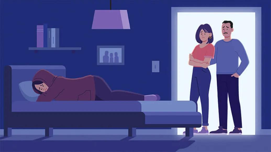 Parents standing at doorway near depressed teenagers bed
