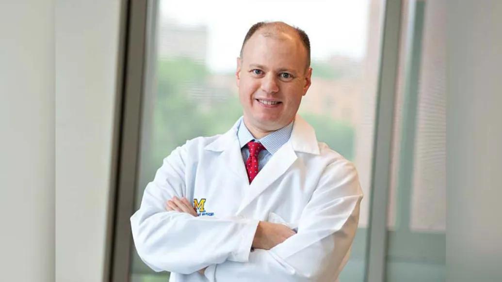 Doctor Stein with arms crossed smiling