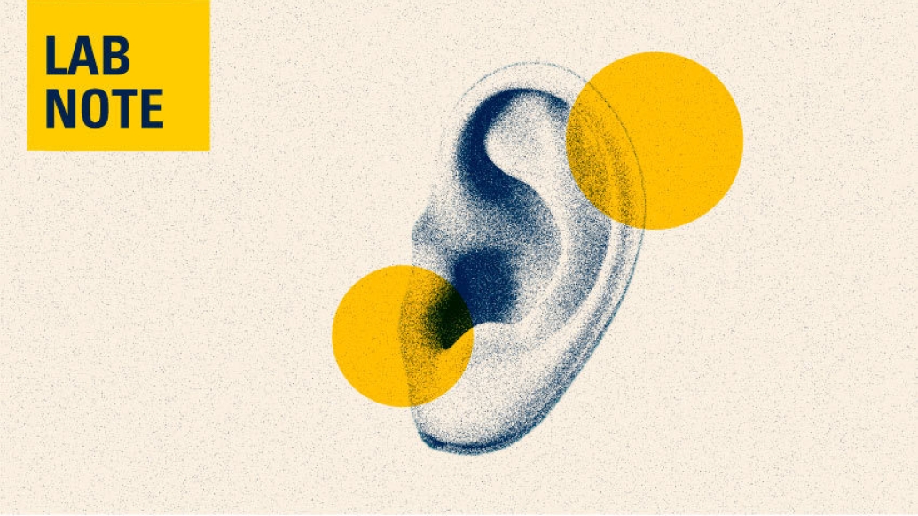 ear with lab note in yellow and blue