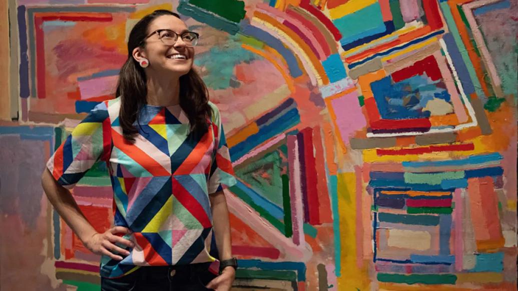 Woman in front of painting 