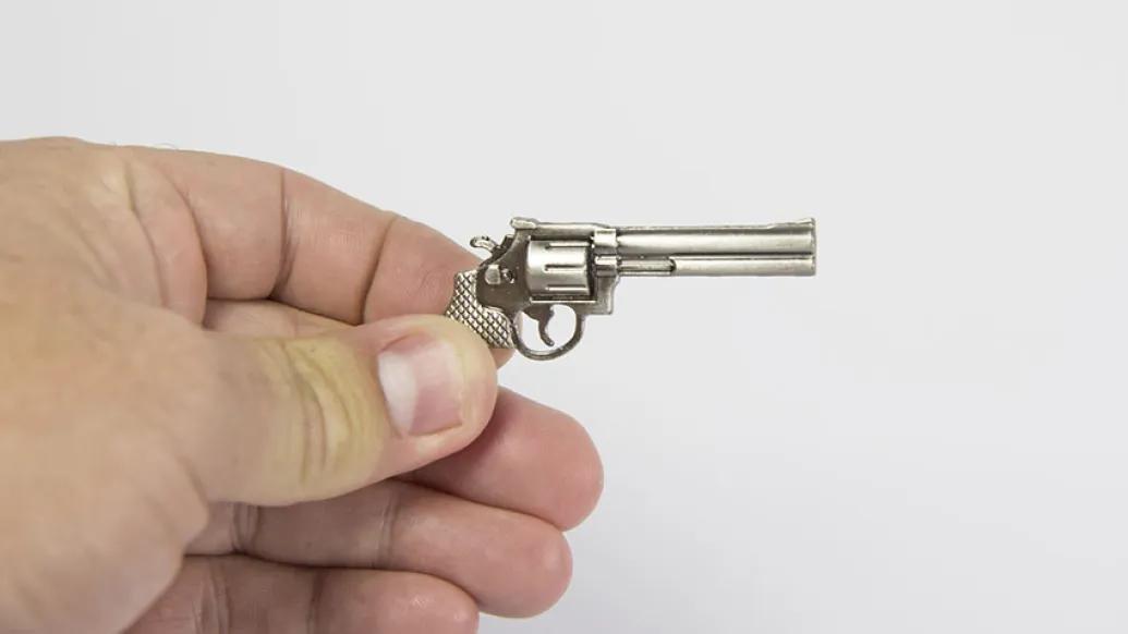 hand and little gun