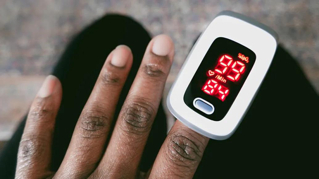 hand and fingers with pulse device oxygen on it 