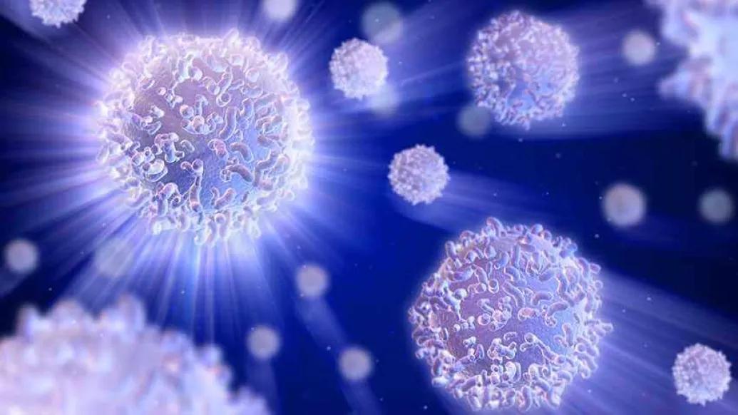 purple-blue cells floating around on dark background