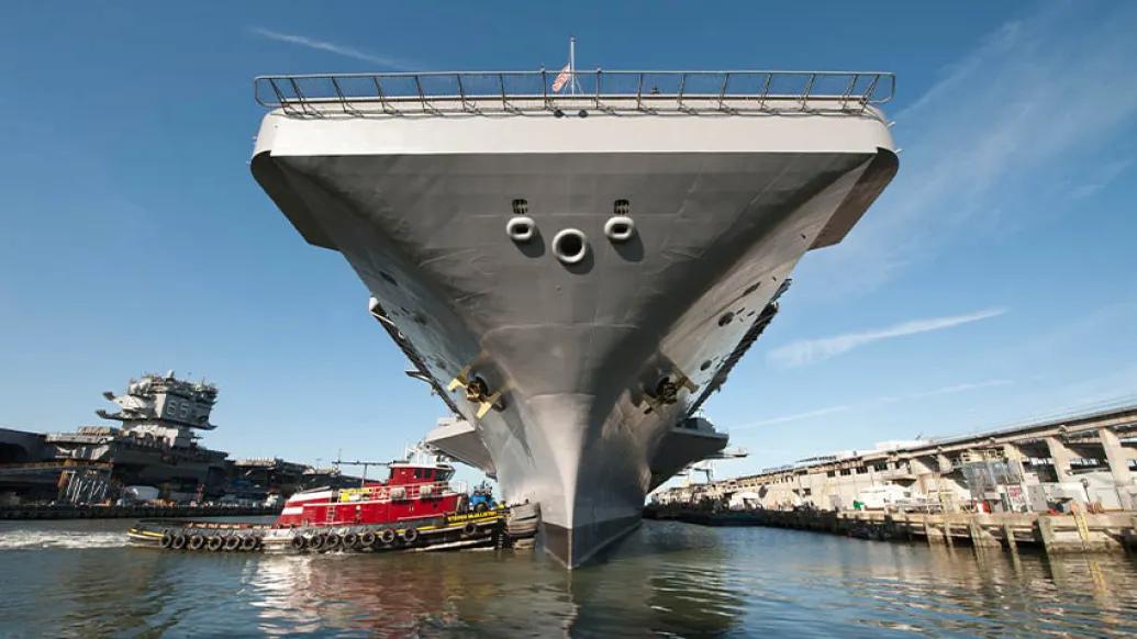 grey navy ship in water 