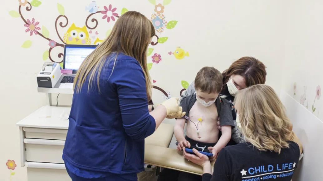 Nurse with children at patient mother clinic