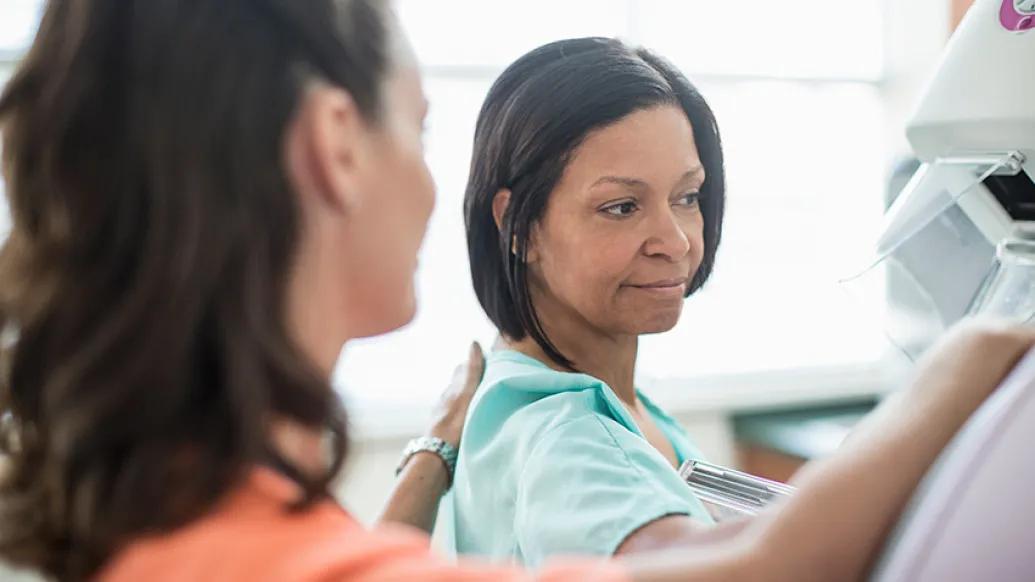 nurse and patient at mammogram machine scan close up